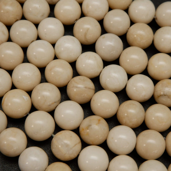 Beige color fossil jasper beads.