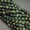 Green and black kambaba jasper beads.