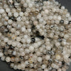 Cloudy milky colored tourmalated quartz beads. Quartz beads with tourmaline inclusions.