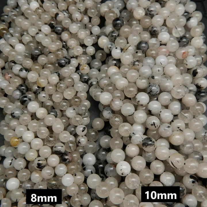Cloudy milky colored tourmalated quartz beads. Quartz beads with tourmaline inclusions.