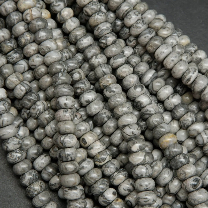 Swirling patterned silver lace agate rondelle beads.