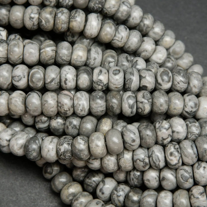 Swirling patterned silver lace agate rondelle beads.