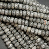 Swirling patterned silver lace agate rondelle beads.