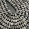 Swirling patterned silver lace agate rondelle beads.