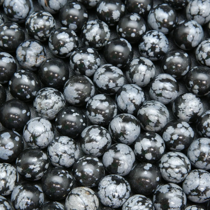 Snowflake obsidian beads. Black matrix with grey ash flakes. 