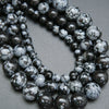 Snowflake obsidian beads. Black matrix with grey ash flakes. 