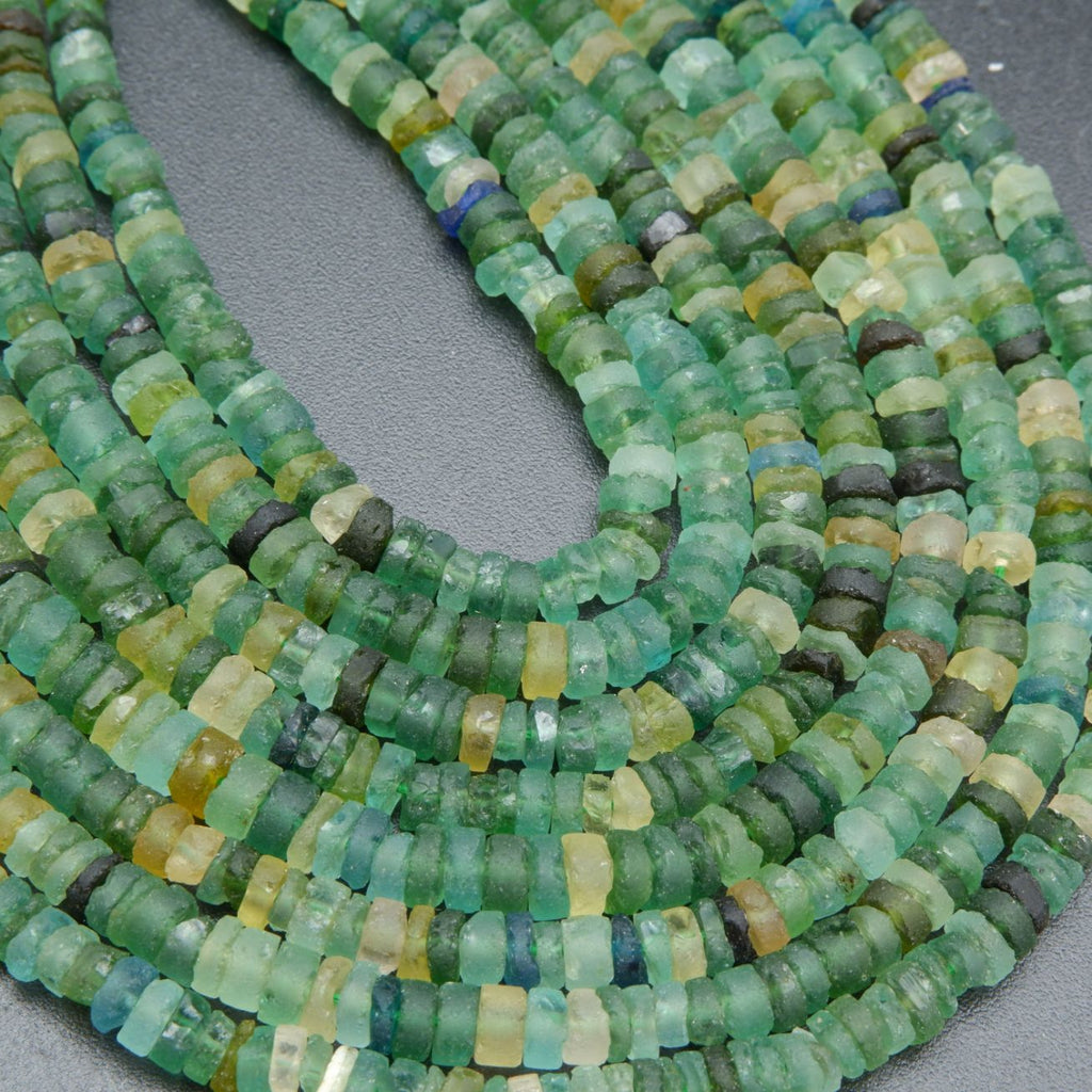 Green disk shape roman glass beads for jewelry making.