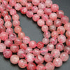 Bright pink  strawberry quartz round faceted beads.