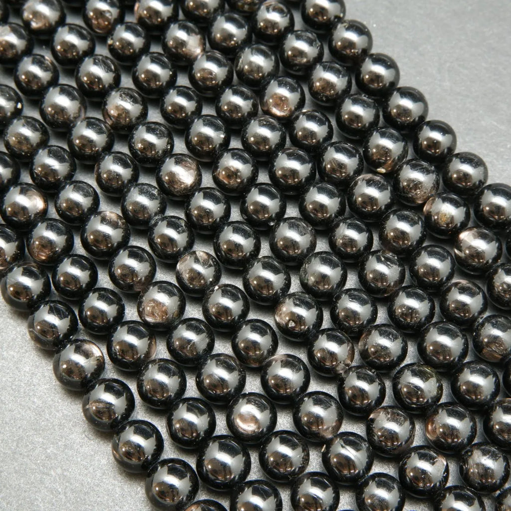 Black Polished round hypersthene beads.
