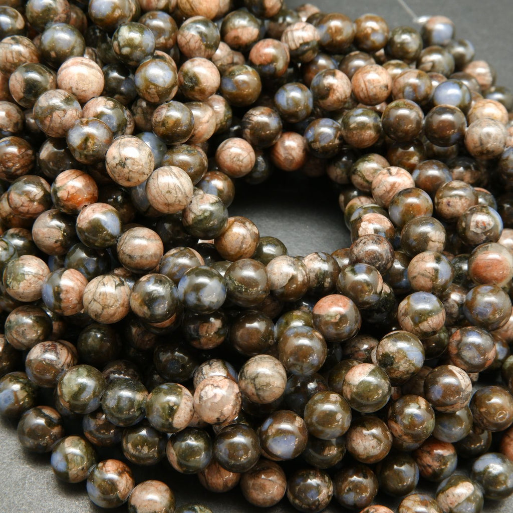 Blue quartz and pink feldspar in brown round beads.
