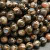 Blue quartz and pink feldspar in brown round beads.