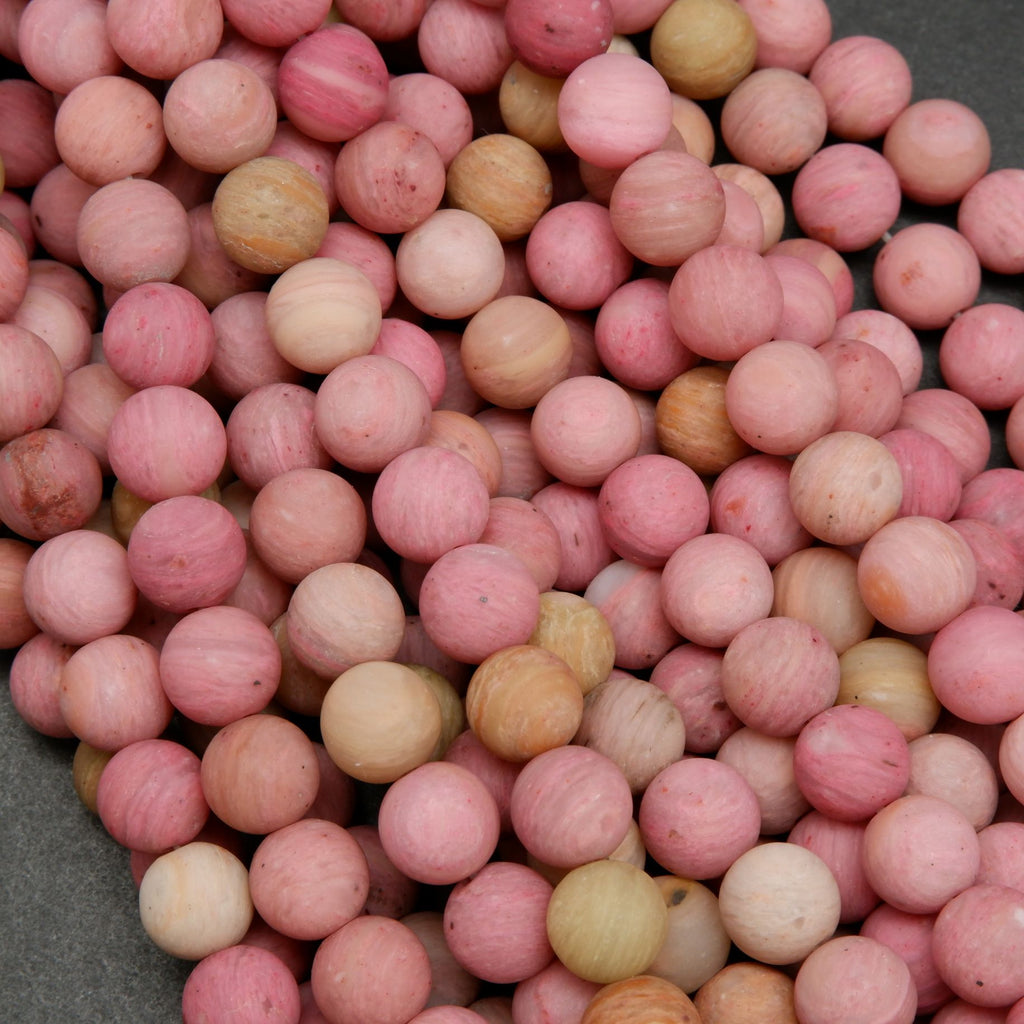 Natural matte finish rhodonite beads.