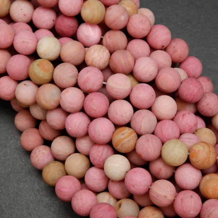 Natural matte finish rhodonite beads.