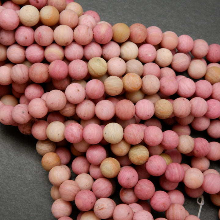 Natural matte finish rhodonite beads.