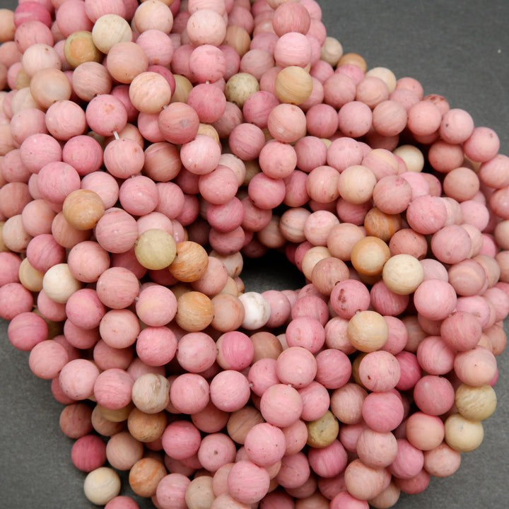 Natural matte finish rhodonite beads.