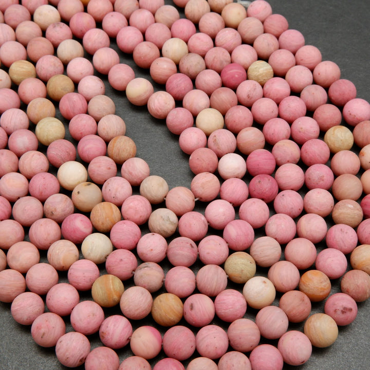 Natural matte finish rhodonite beads.