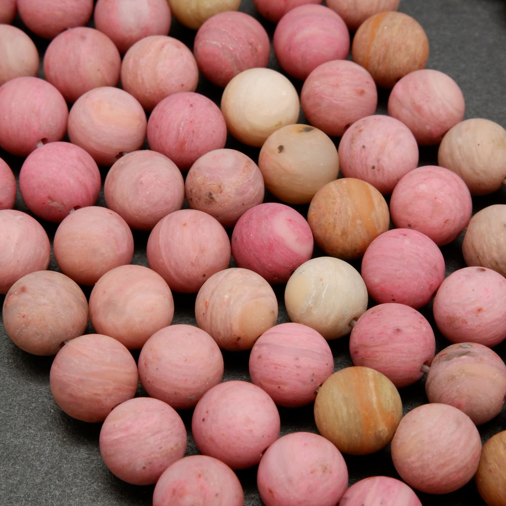 Natural matte finish rhodonite beads.