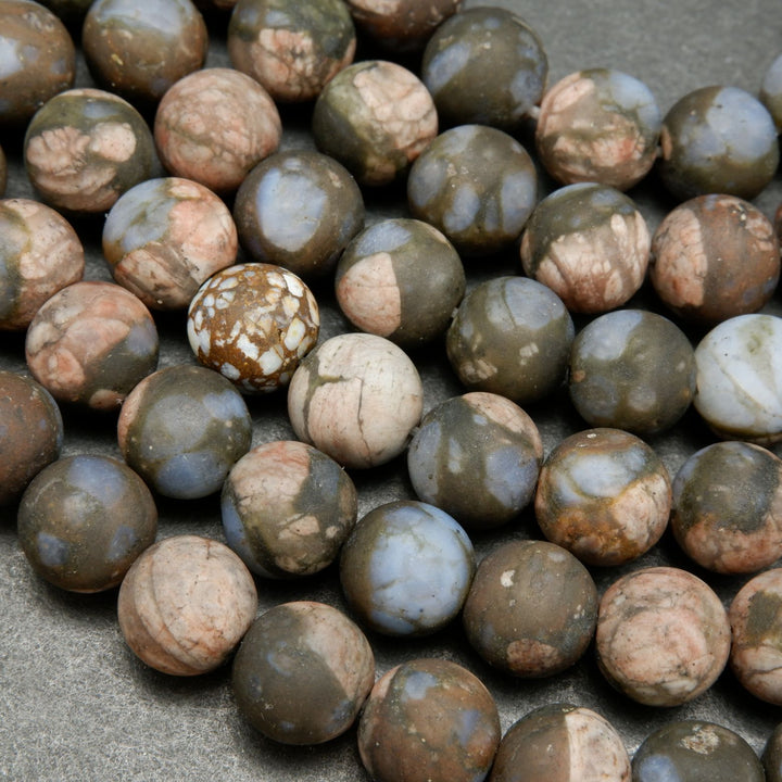 Brown and Pink Rhyolite Loose Beads From Texas.