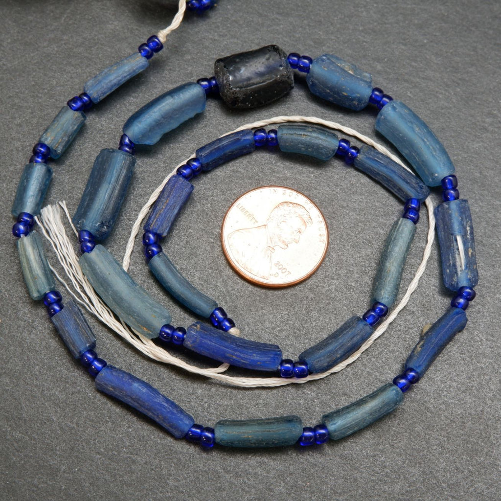 Blue roman glass tube beads.