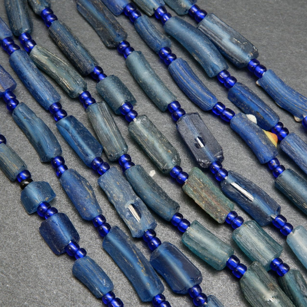 Blue roman glass tube beads.