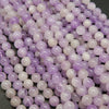 Lavender amethyst beads. Pale purple color with white cloudiness mixed in.