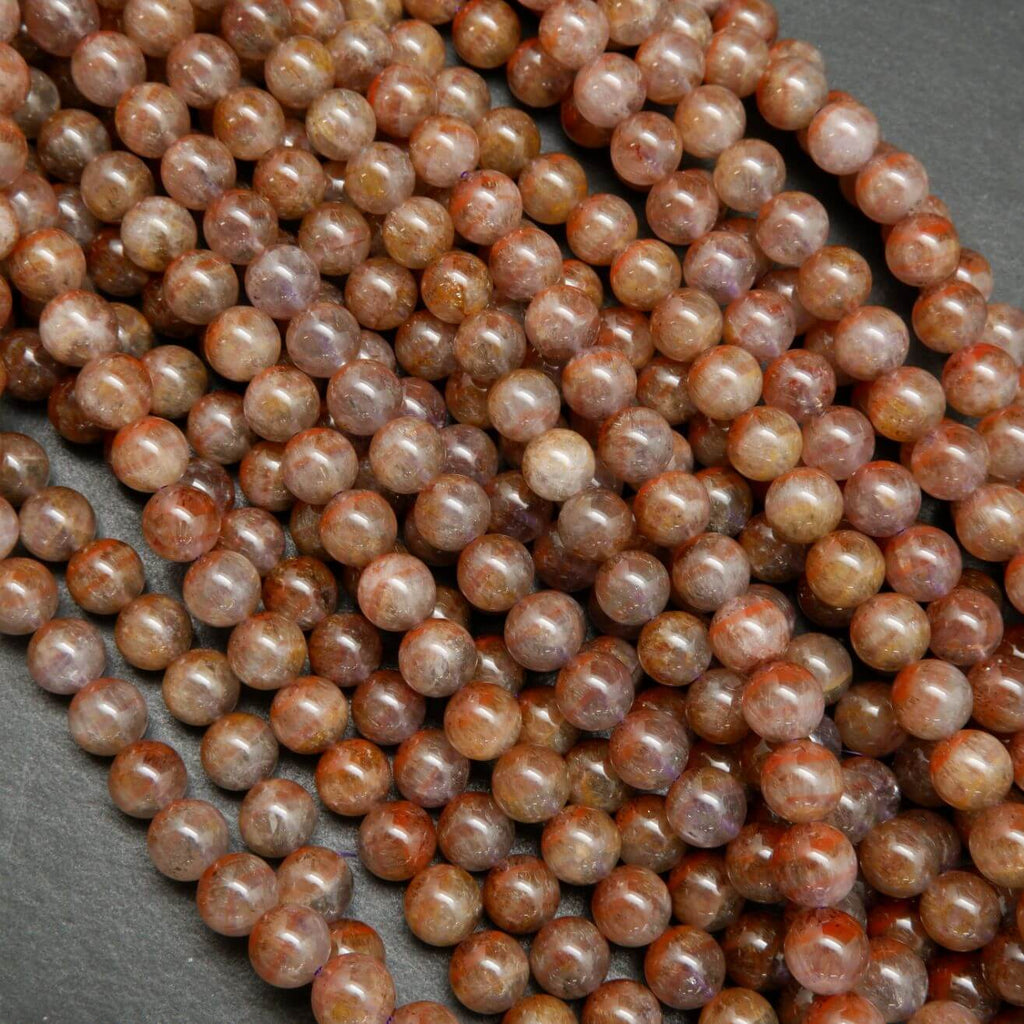 Natural Auralite 23 round loose beads.