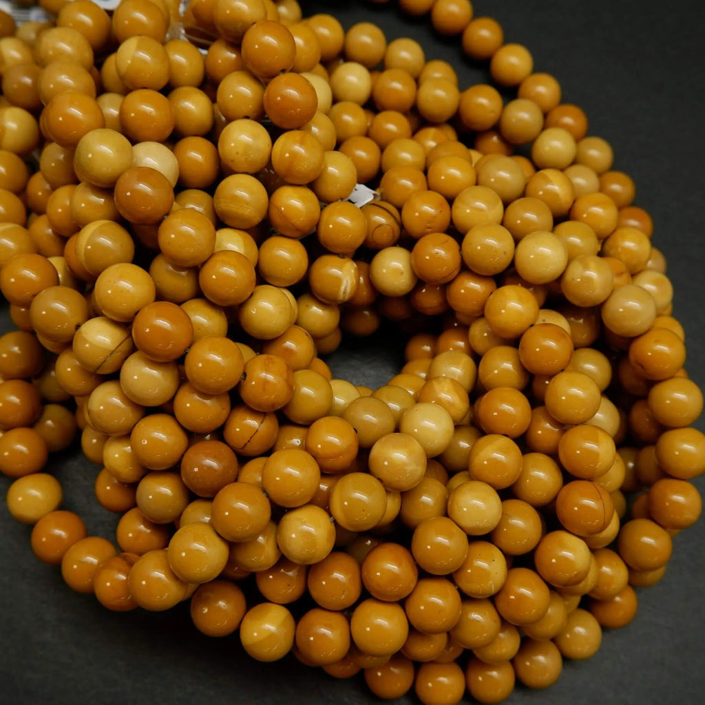 Round yellow beads for jewelry making. Australian Yellow Mookaite loose beads.