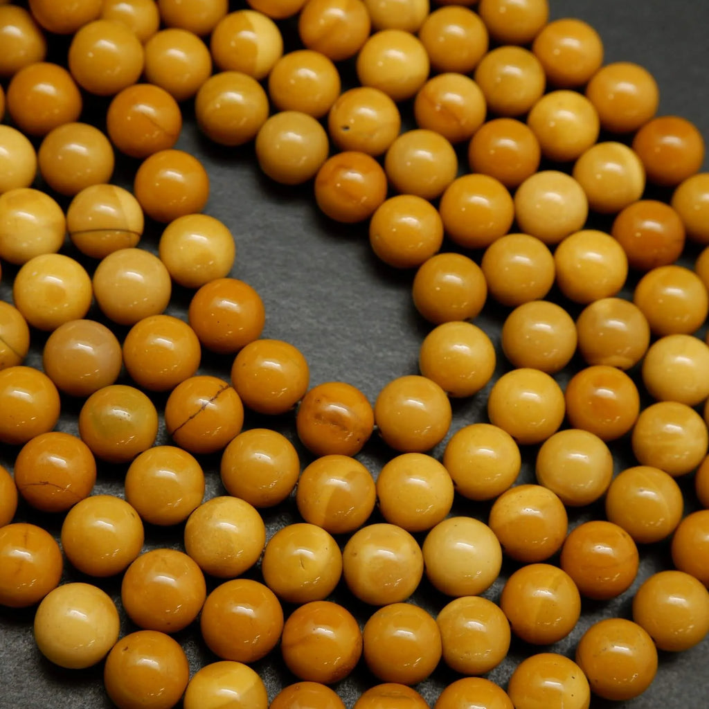 Round yellow beads for jewelry making. Australian Yellow Mookaite loose beads.