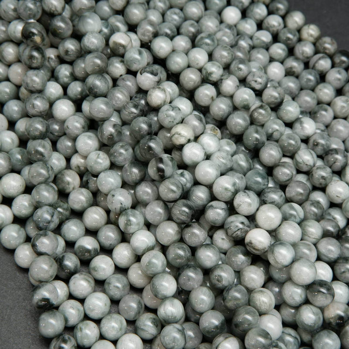 Light grey with swirling black eagle eye beads