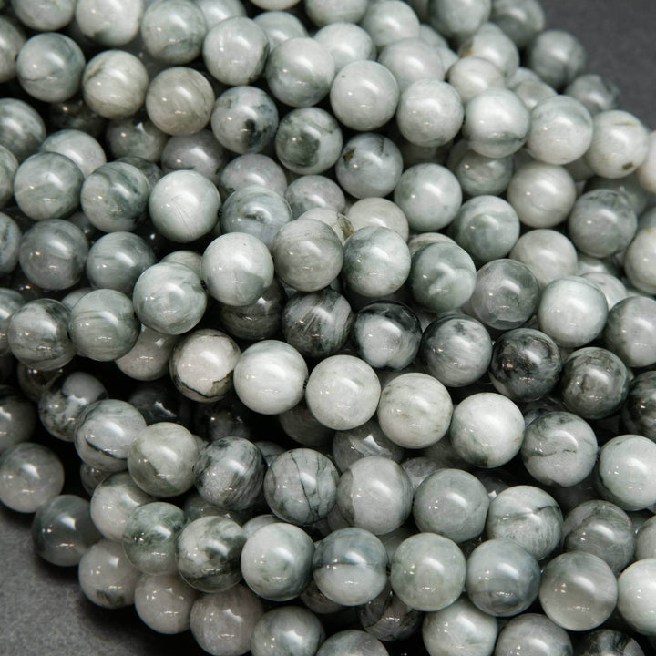 Light grey with swirling black eagle eye beads
