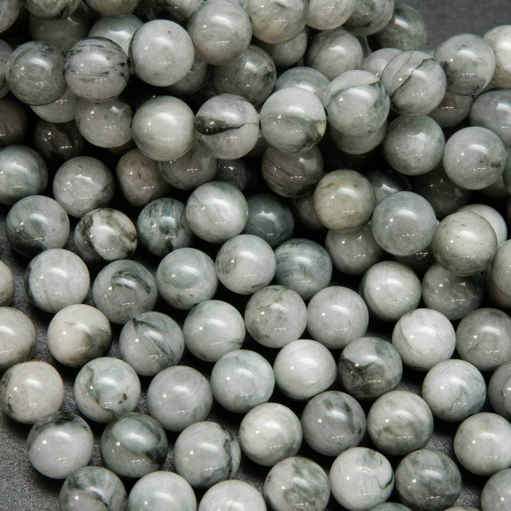 Light grey with swirling black eagle eye beads