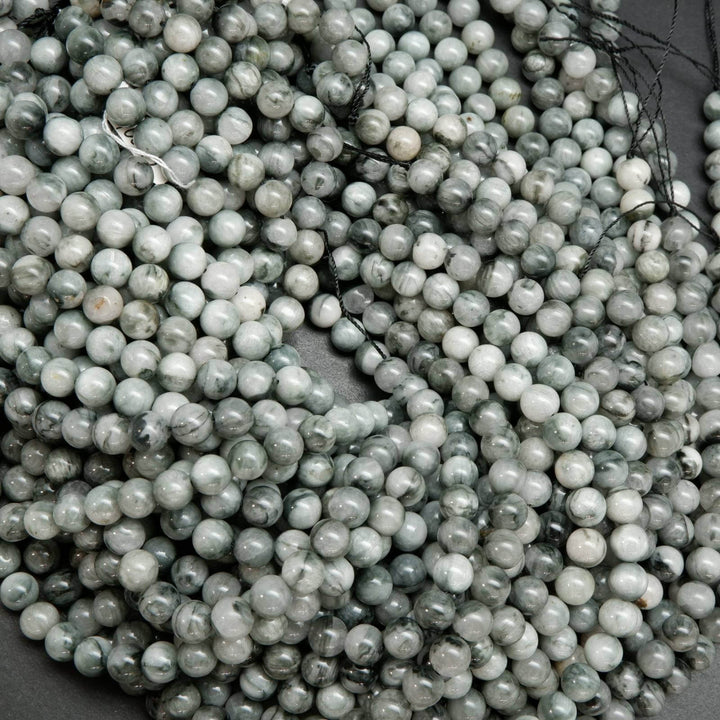 Light grey with swirling black eagle eye beads