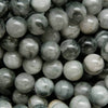 Light grey with swirling black eagle eye beads