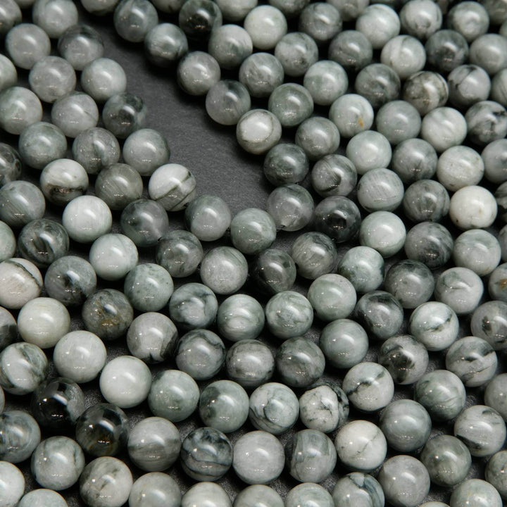 Light grey with swirling black eagle eye beads