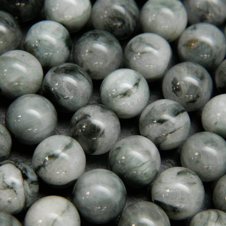 Light grey with swirling black eagle eye beads