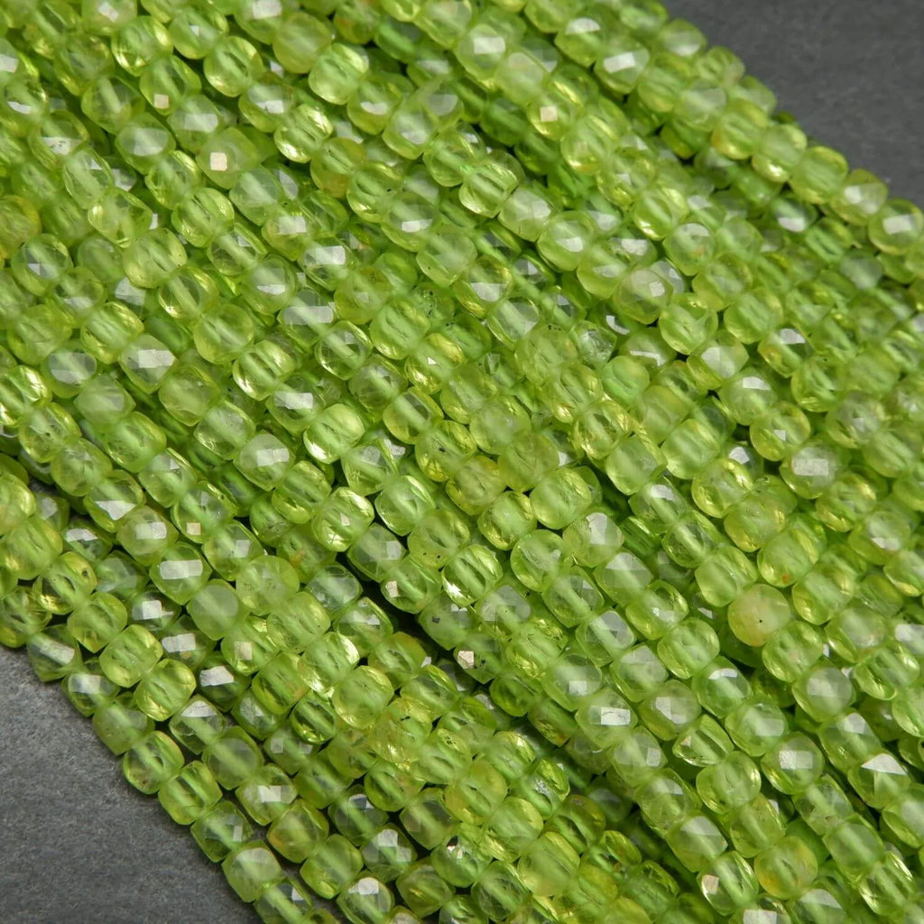 Green cube shape peridot beads.