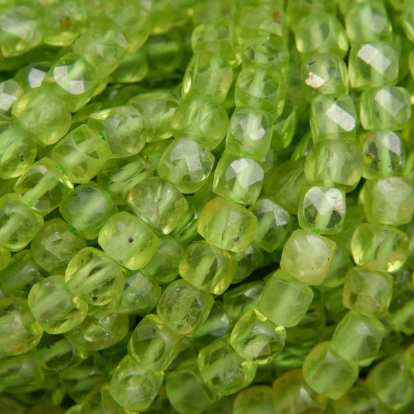 Green cube shape peridot beads.