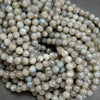 Faceted grey labradorite beads.