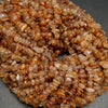 Brown rutilated quartz beads.