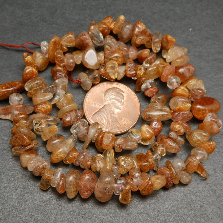 Brown rutilated quartz beads.