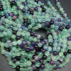 Round green and purple fluorite beads for jewelry making