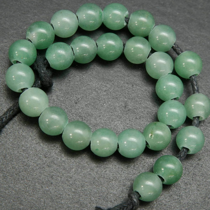 Strand Length: approx. 7.5-8 inches | Hole Size: 2.5mm  8mm - approx. 25 beads  10mm - approx. 20 beads  Beautiful natural large hole yellow jade beads.