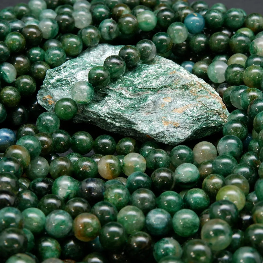 Green mica beads and rough material.