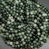 Green rutilated quartz beads.
