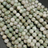Polished finish round harmony jasper beads for handmade jewelry crafting.