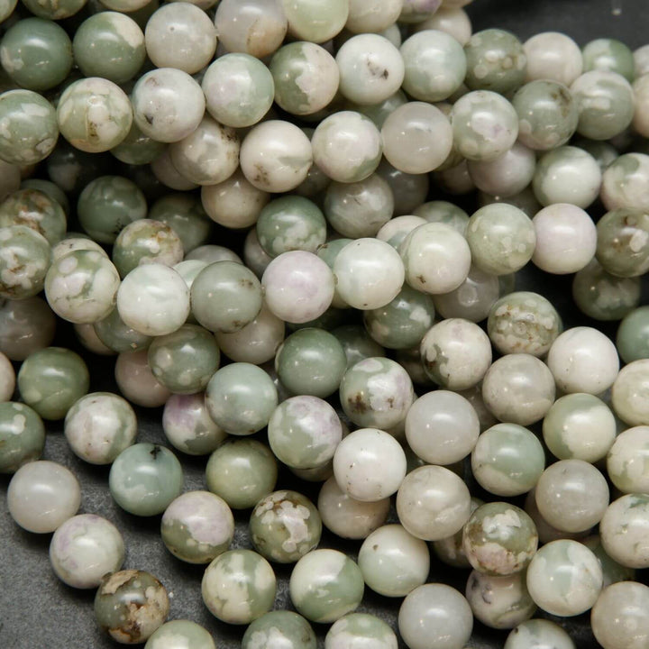 Polished finish round harmony jasper beads for handmade jewelry crafting.
