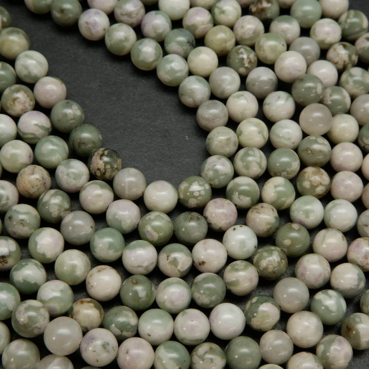 Polished finish round harmony jasper beads for handmade jewelry crafting.