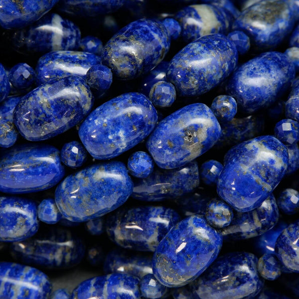 Polished Finish lapis lazuli barrel shape beads with round faceted spacers between. Loose beads on a string for jewelry making.