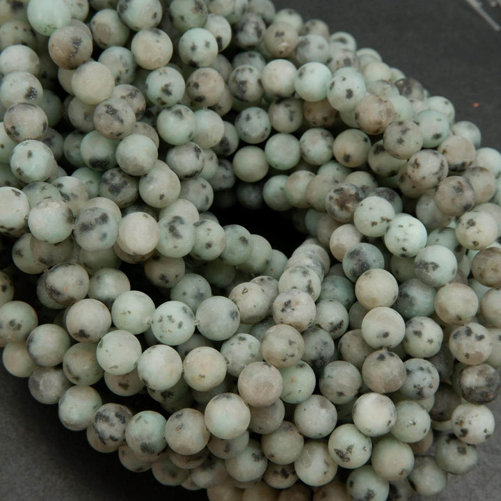 Matte finish mint green kiwi jasper beads.