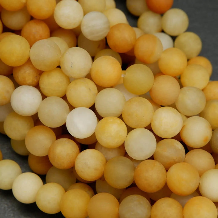 Matte finish yellow jade beads for jewelry making.